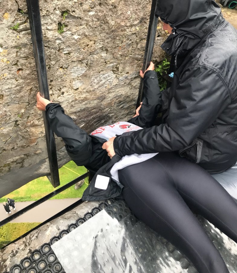 Woman kissing blarney stone